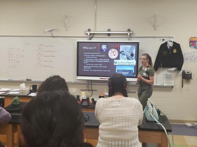 Medical student Libbie Milks speaks with high school students about medicine as part of the LIC.  