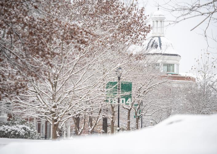 Snow covers the ground, trees and buildings at Ohio University's Athens Campus