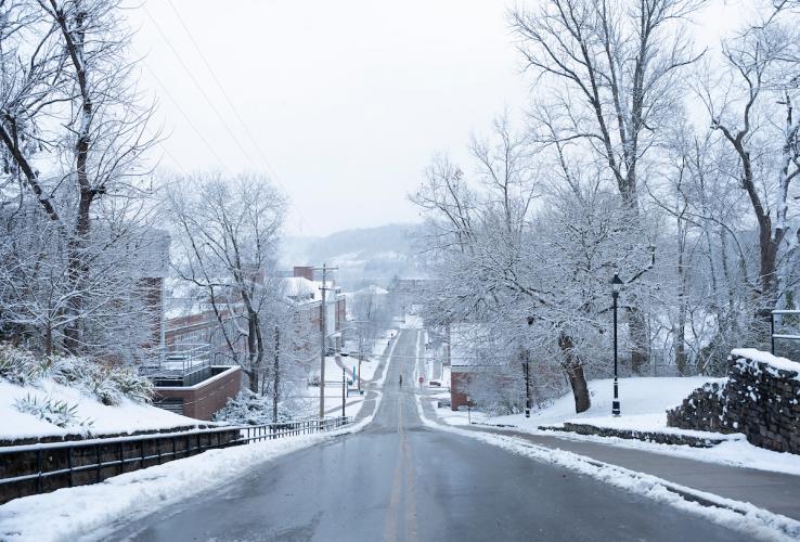 Snow covers the trees and buildings on OHIO's campus from this view from the top of Jeff Hill