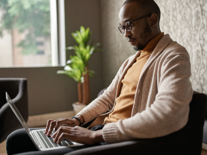 professional working in office typing on computer