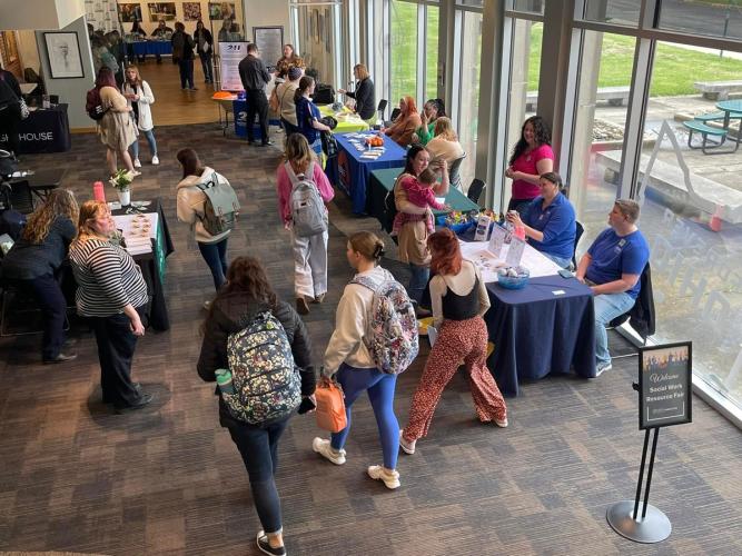 Students and community members visit tables and talk with representative at the Social Work Resource Fair at Ohio University Lancaster