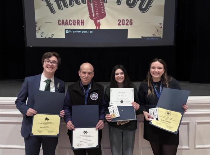 Jim Sand and OHIO students June Meehan, Megan Luckiw and Devin Lands are shown at the awards ceremony