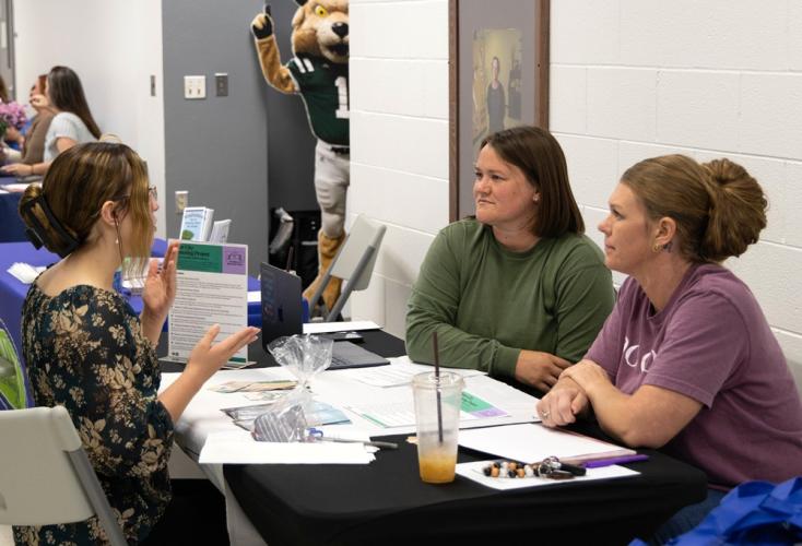 two women interview a third woman