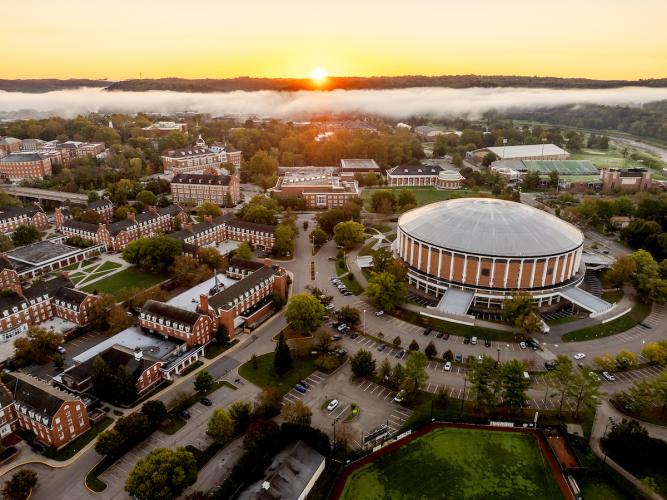 The Convocation Center and West Green are shown in this aerial photo, in the background, there is fog over the Hocking River