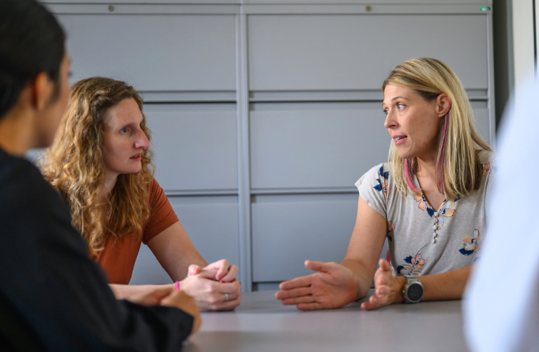 clinical professionals meeting in an office