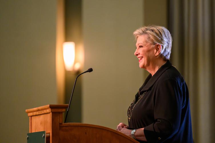 President Lori Stewart Gonzalez speaks at the podium at the State of the University Address in Walter Hall