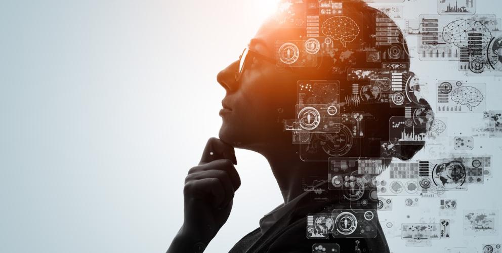 A graphic design  of a person thinking with computer images shown  around the person