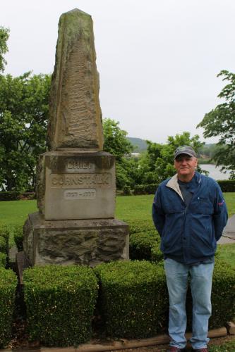 Jim Lee standing outdoors next to monument