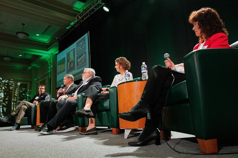 Five panelists talk on stage at the State of the Region Conference in the Baker Center Ballroom
