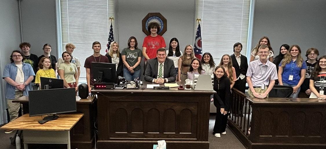 Participants in the Summer Law and Trial Institute are shown in the courtroom with Judge Saunders