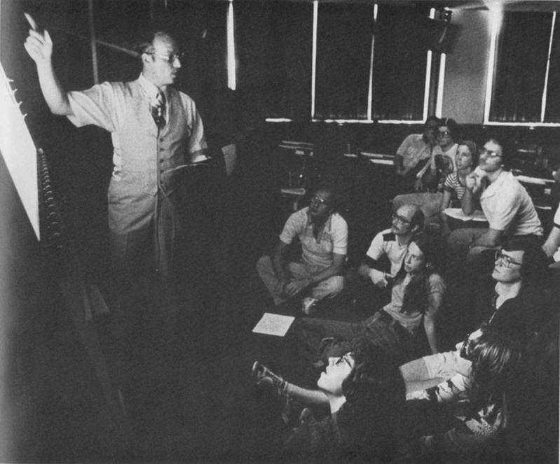 Historical image of HCOM class with instructor