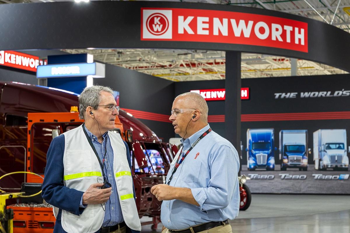 Dean Patrick Fox talks with a Kenworth leader during a tour of the Kenworth Plant in Chillicothe