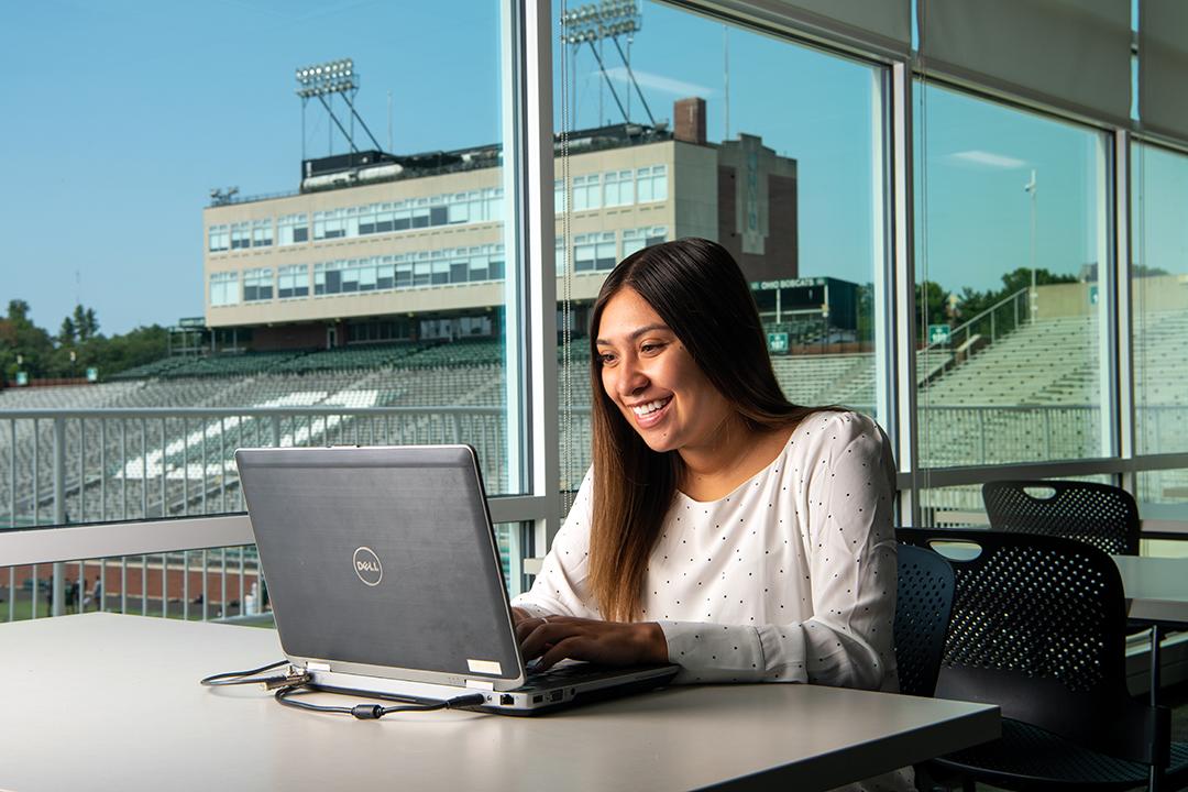 An OHIO sports administration student works online at OHIO's Sook Center.
