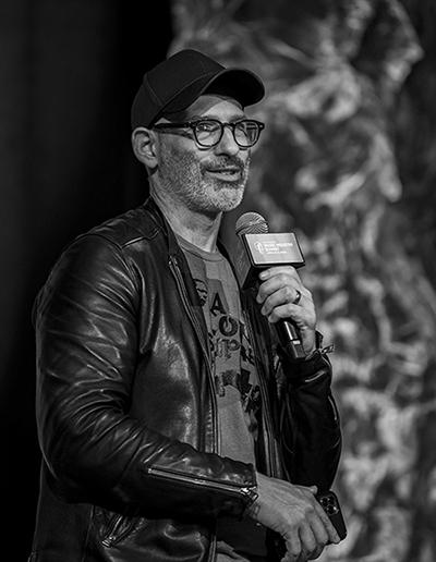 man with hat and microphone