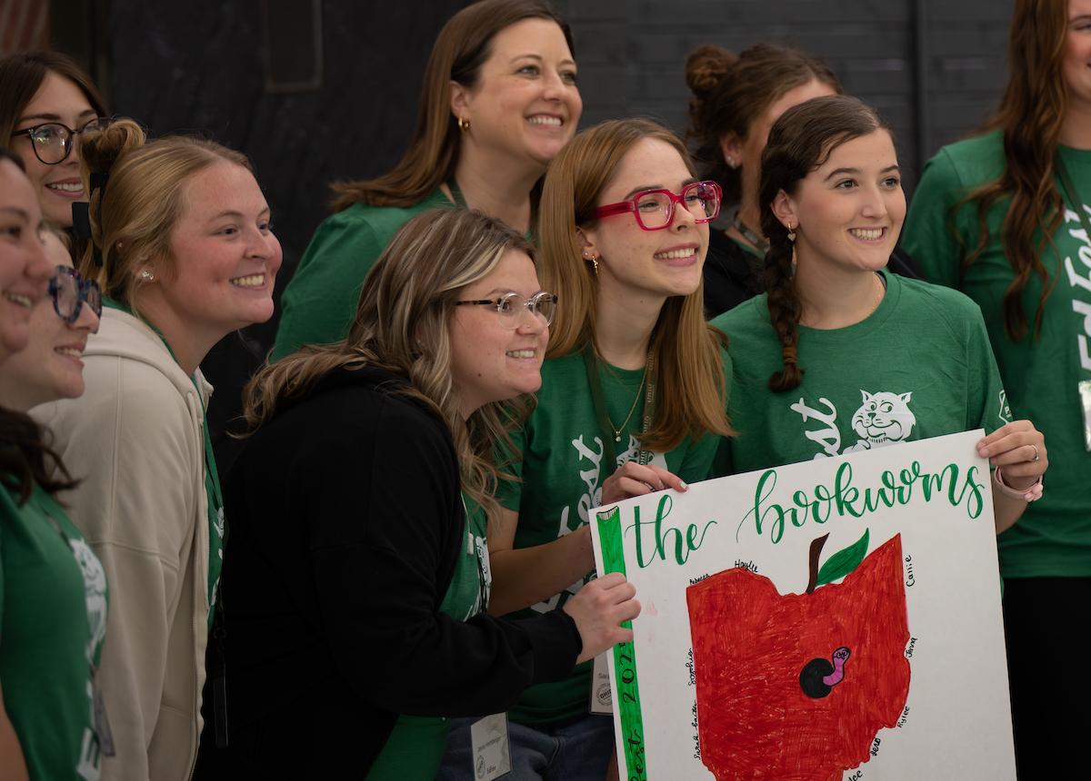 Students hold a poster