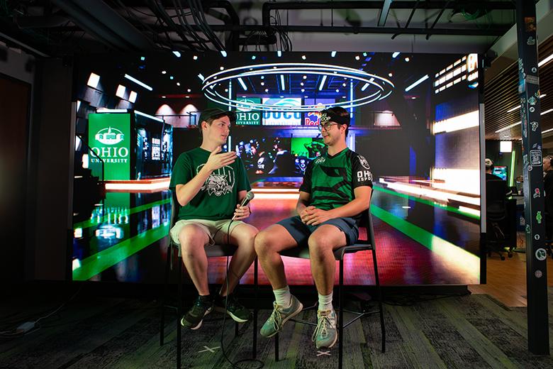OHIO students broadcast in front of the new LED Esports Arena Wall.