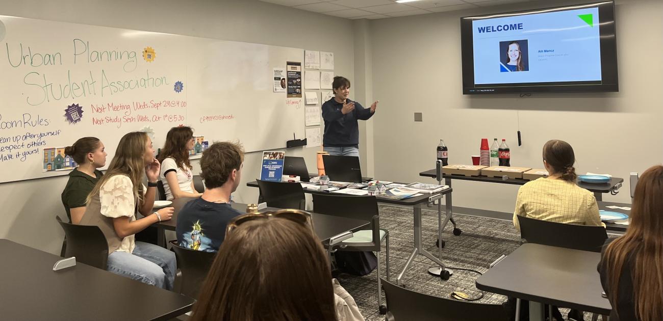 Alli Mancz leads a discussion in a classroom for OHIO geography students