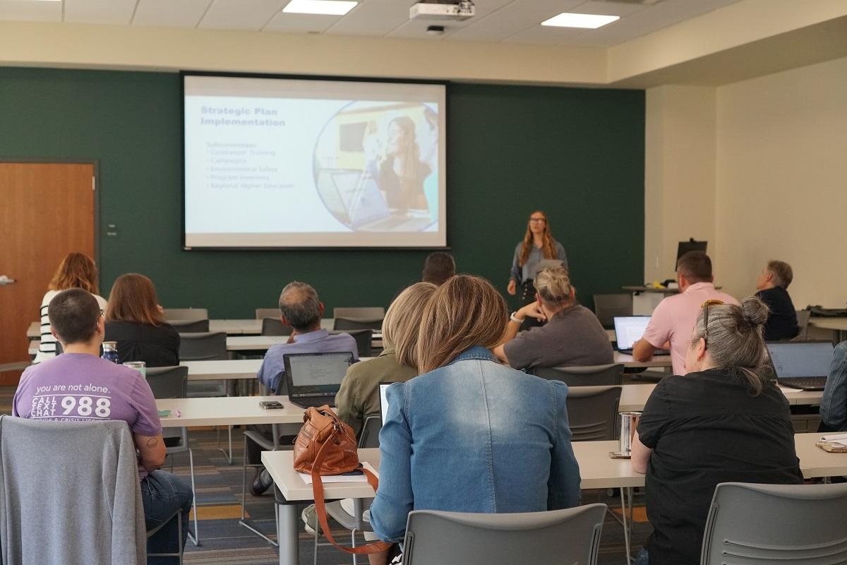An individual leads a training program in an OHIO classroom