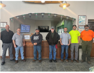 A group of OHIO employees who participated in the food drive stand together for a photo