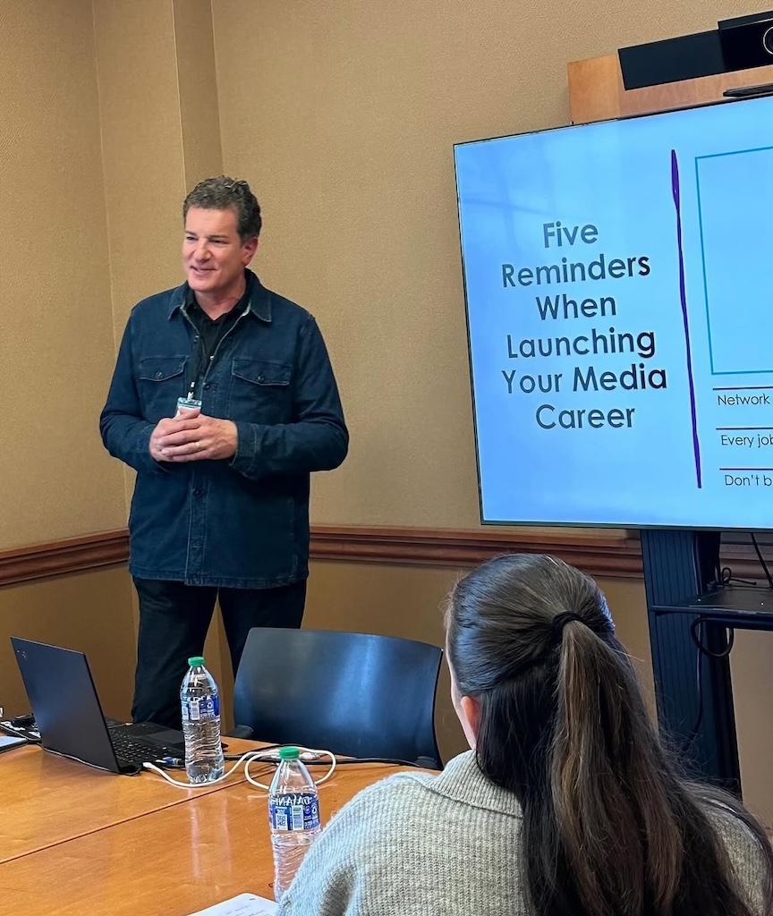 Alumni presenting a presentation