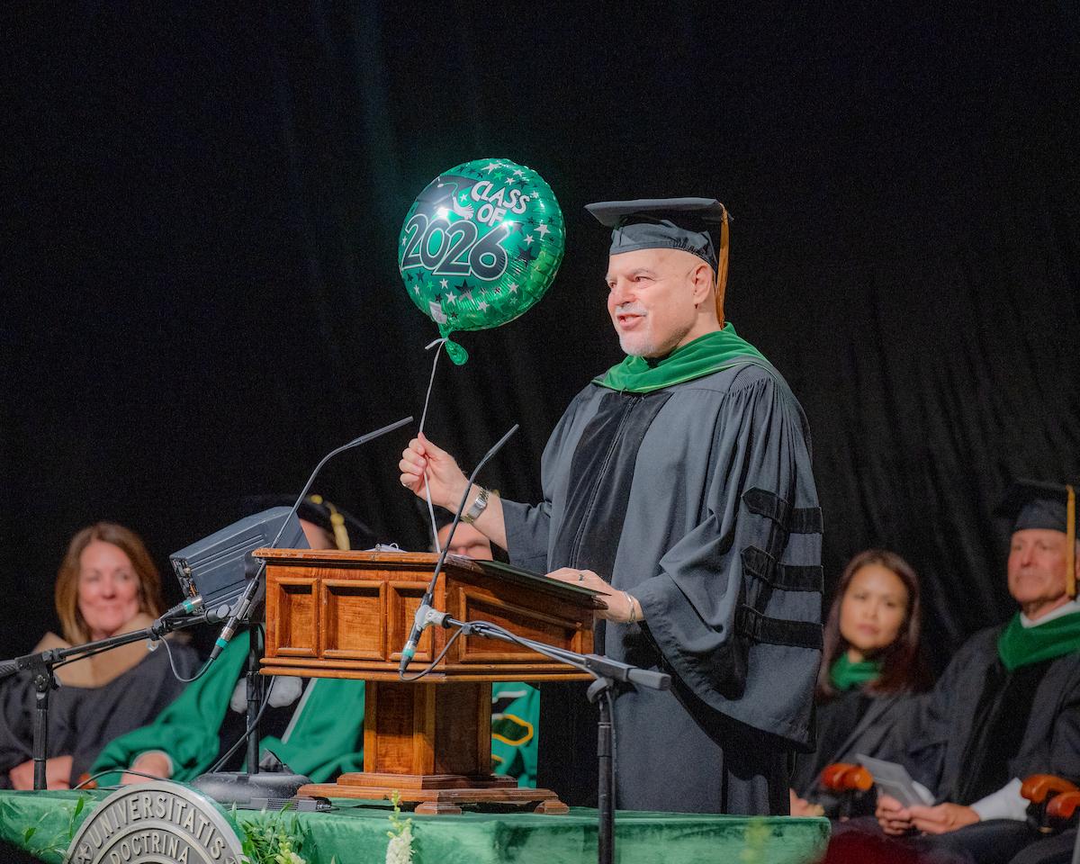 Commencement speaker shares wisdom during 2026 HCOM graduation ceremony.