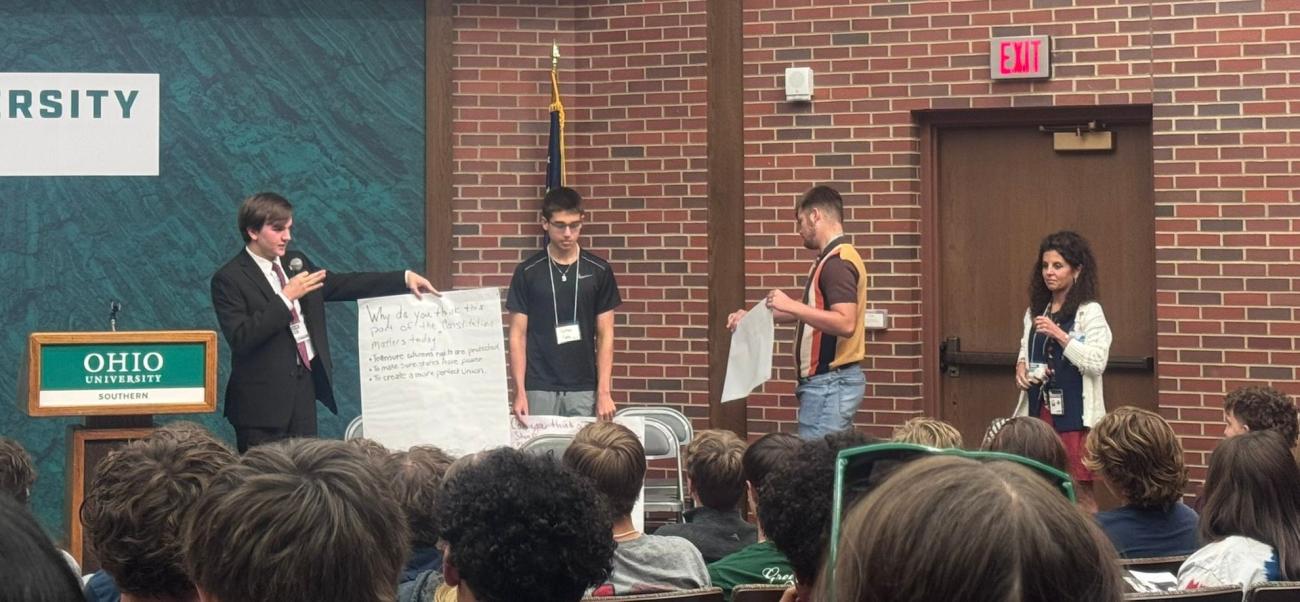 Students give a presentation in front of a large crowd at Ohio University Southern