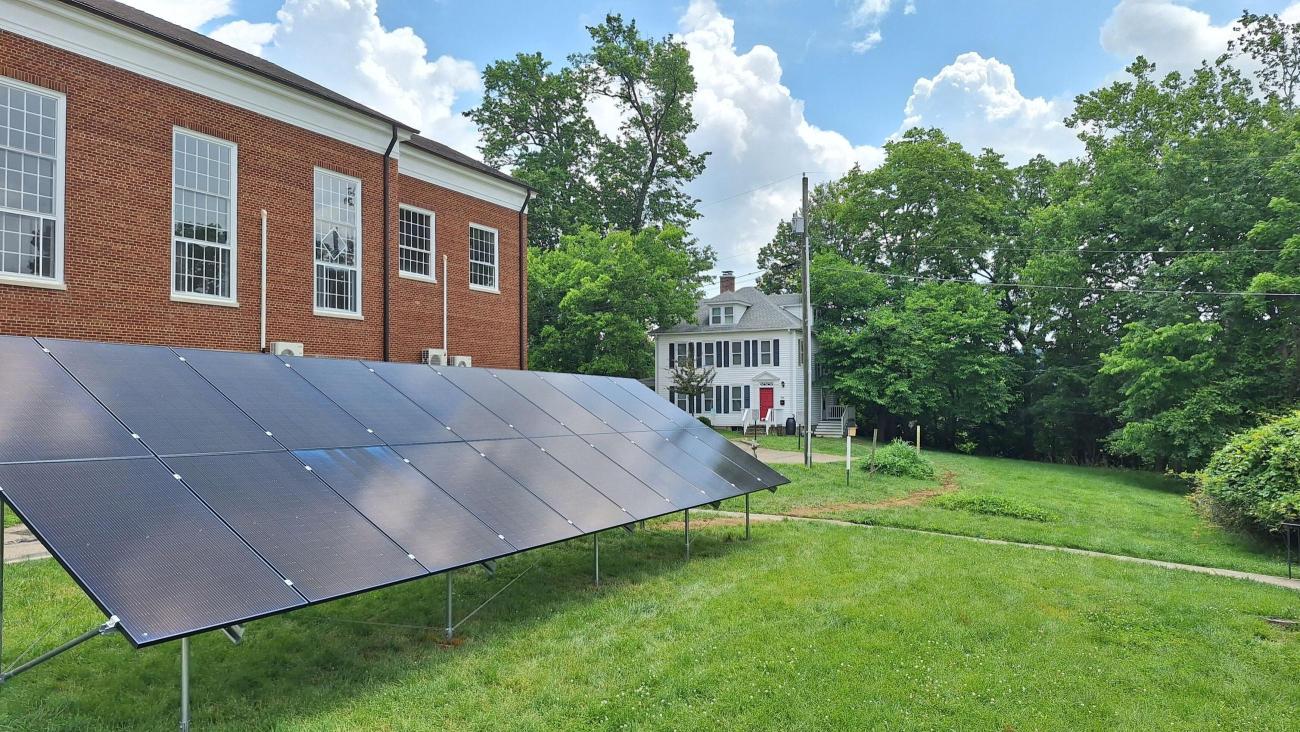 Solar panels sit in front of the OHIO Ecohouse.