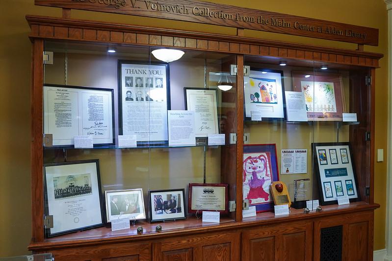 A display shows several items in the Voinovich Archives