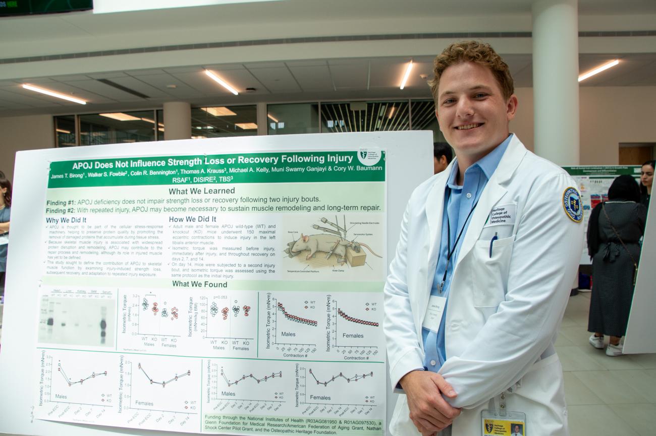 James Birong, who participated in the RSAF program, stands in front of his research poster