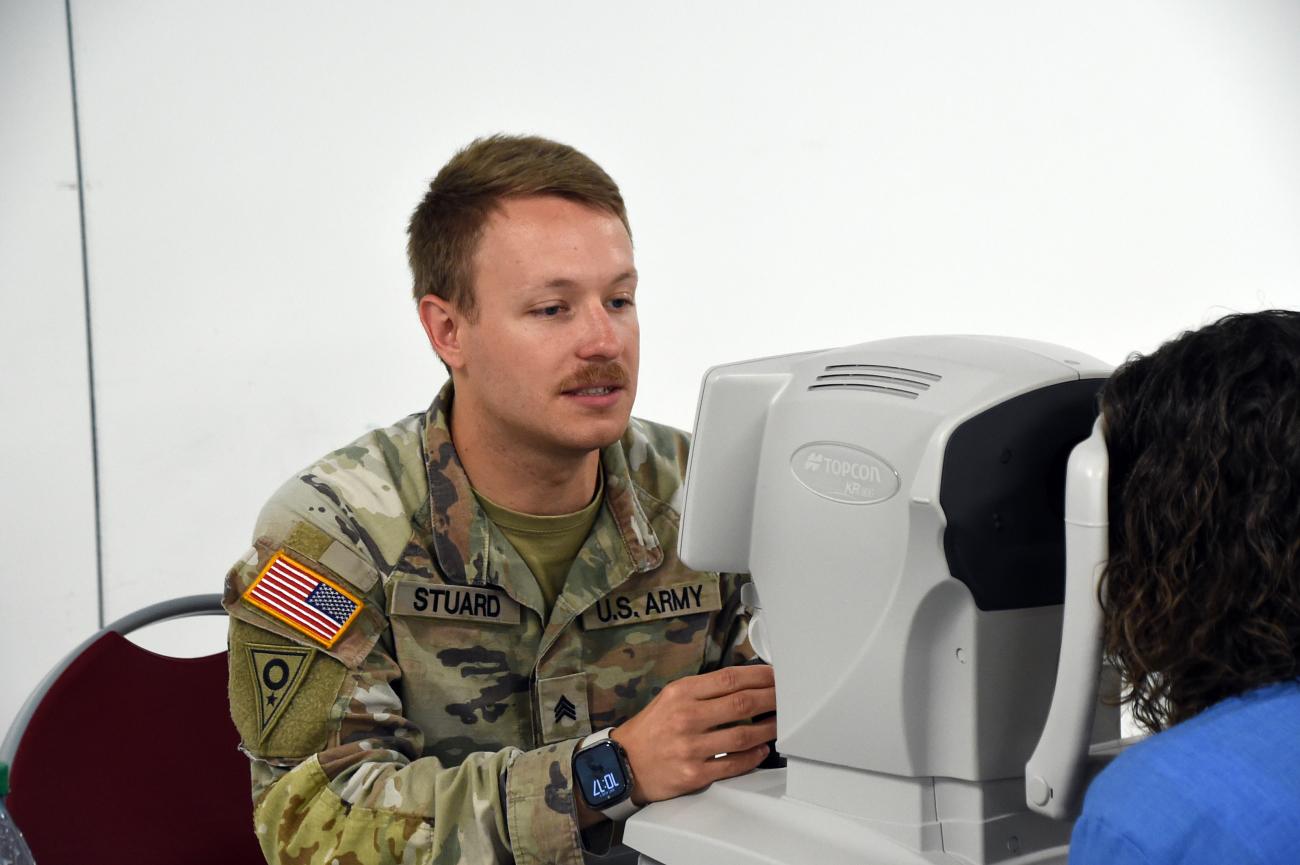 National Guard member Nicholas Stuard helps a patient