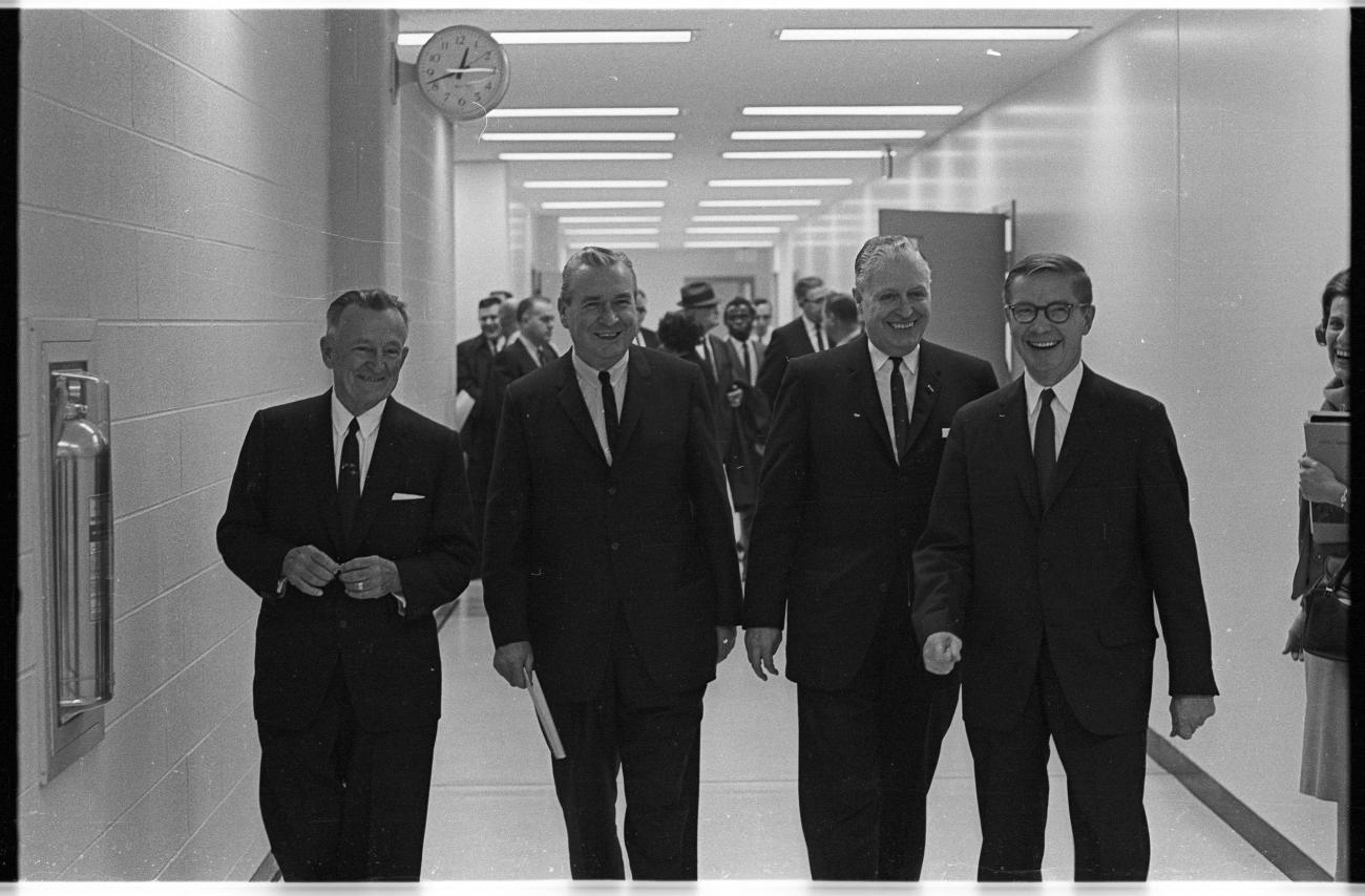 four men walking down the hall at Ohio University Chillicothe 
