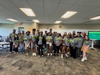 Participants in Become U pose for group portrait