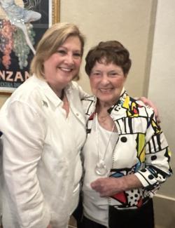 Ohio University President Lori Stewart Gonzalez stands next to alumna Jeanette Grasselli Brown with her arm over Jeanette's shoulder