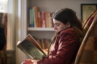 Moore reading Wuthering Heights.