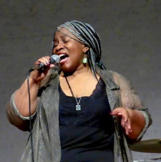 Lady D is shown singing