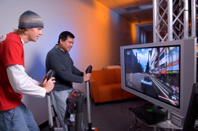 Two Ohio University students test game play in the GRID Lab