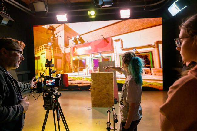 Media Arts and Studies Associate Professor Brian Plow and Media Arts Production students work the LED Wall.