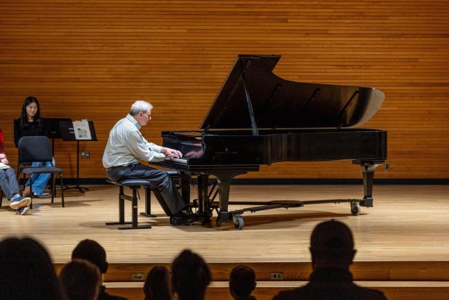 Provost Leo playing piano