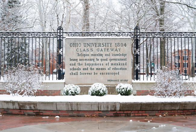The Class Gateway is covered in snow, and the College Green is shown behind it, also covered in snow