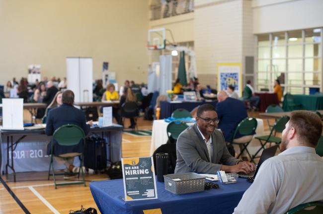 An OHIO student talks with an employer at the Education Career Fair