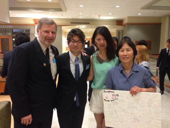 Joung Hee Krzic and Gerry Krzic are shown with Chubu University students