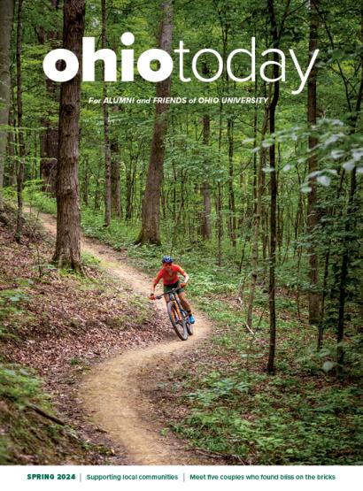 cover of OHIO Today magazine featuring a biker riding down a wooded path