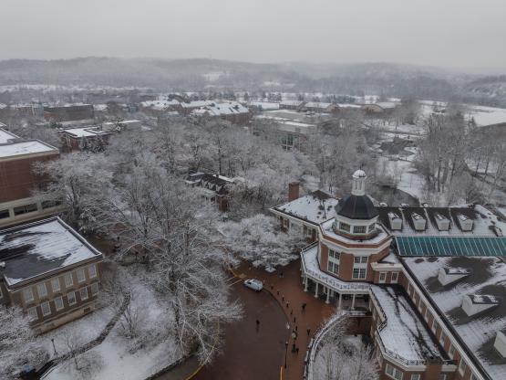 Baker University Center and the area around it is shown from above on a snowy winter day 