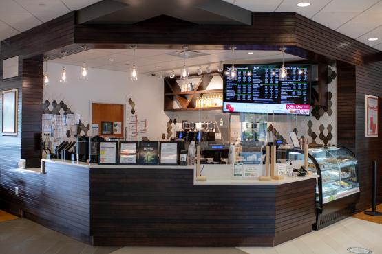 An image of the inside of The Front Room, showing mainly the front counter and the area behind it