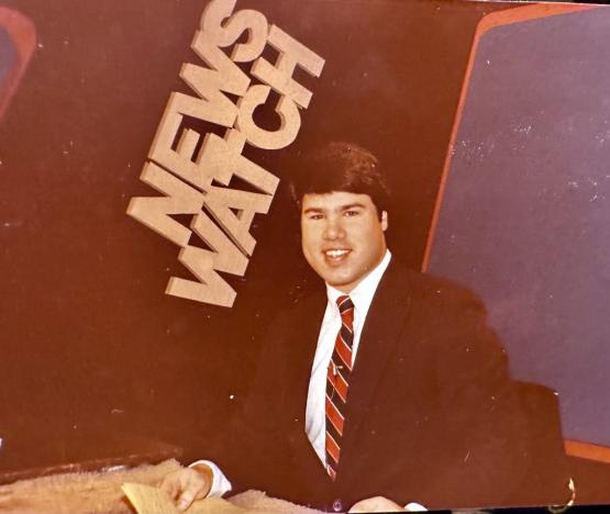 Robb Metry is shown when he was a student sitting at the broadcast desk on the NewsWatch set