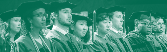 A group of faculty in academic regalia sit in a row