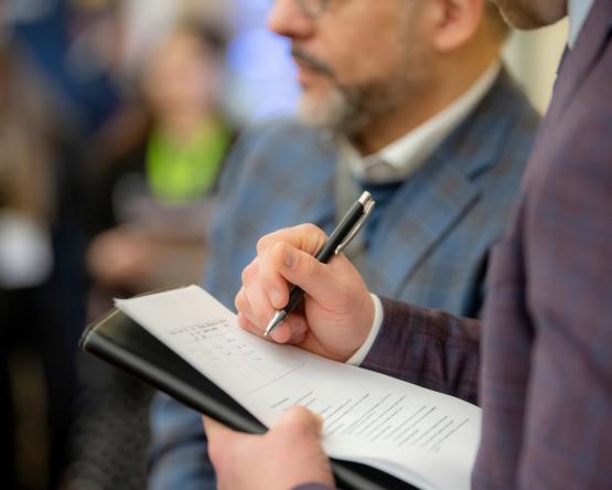 An individual holds a resume at a Career Fair at Ohio University