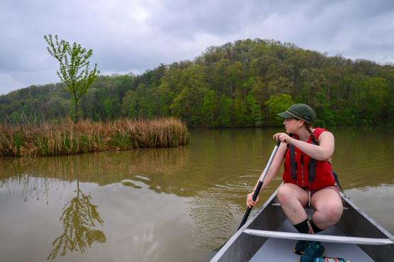 Helena Karlstrom paddles a canoe at Strouds Run State Park
