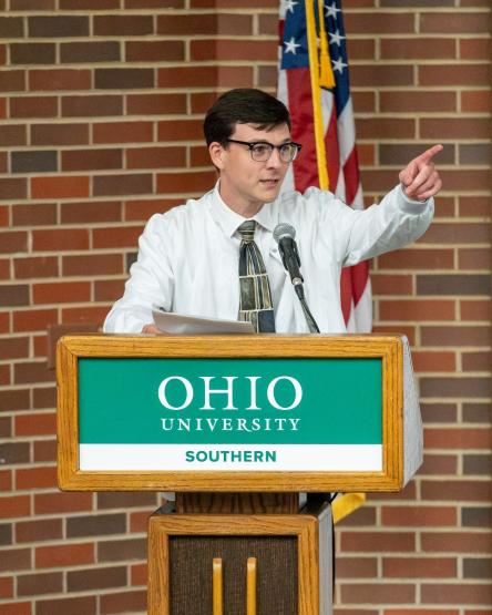 Kade Huff speaks at the podium during an event at Ohio University Southern