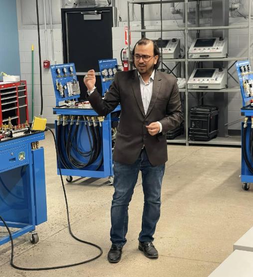 Dr. Syed Ahmed speaks while giving a tour of a laboratory in the Fairfield County Workforce Center